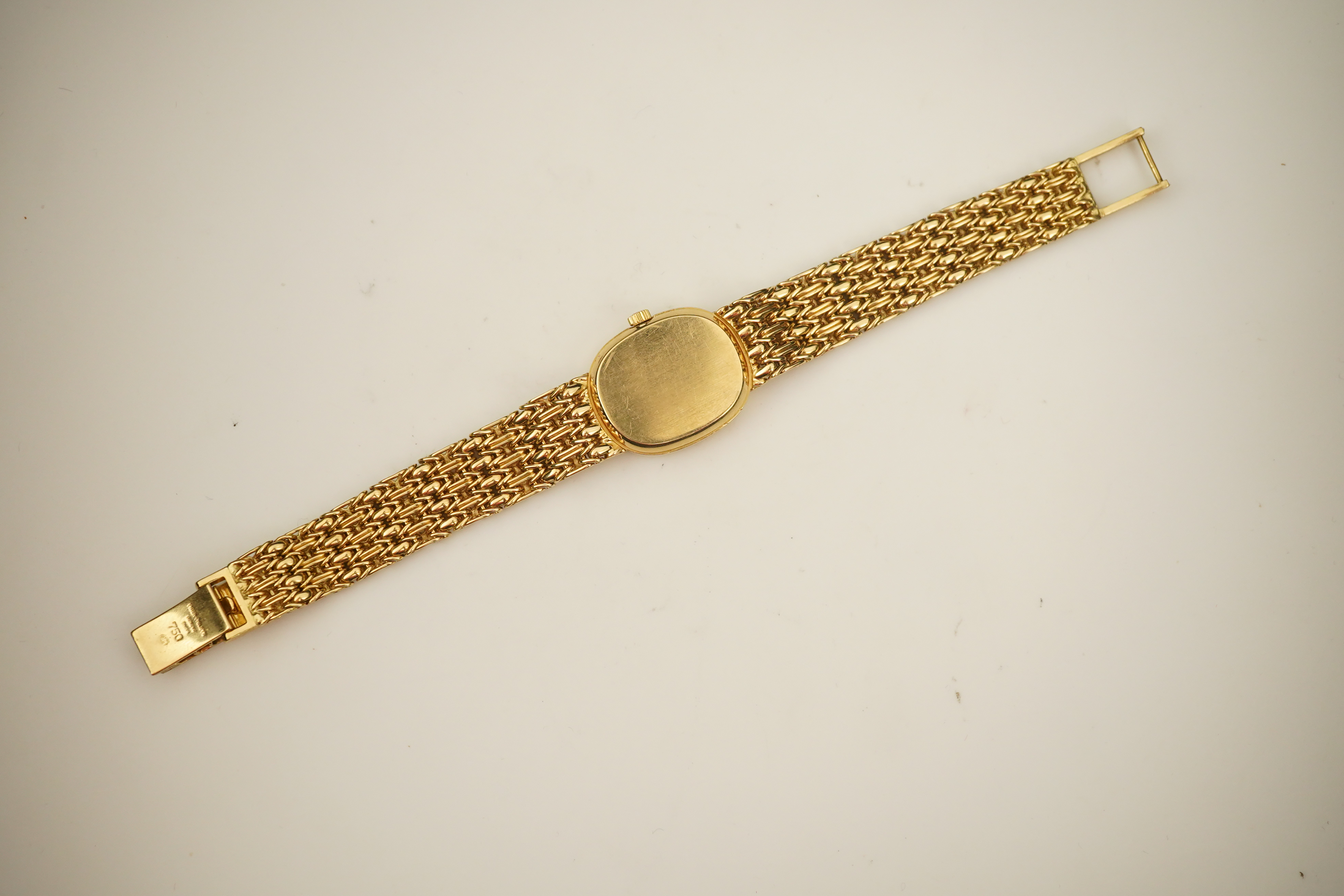 A lady's 18ct gold Patek Philippe manual wind wrist watch, on an integral 18ct gold Patek Philippe bracelet